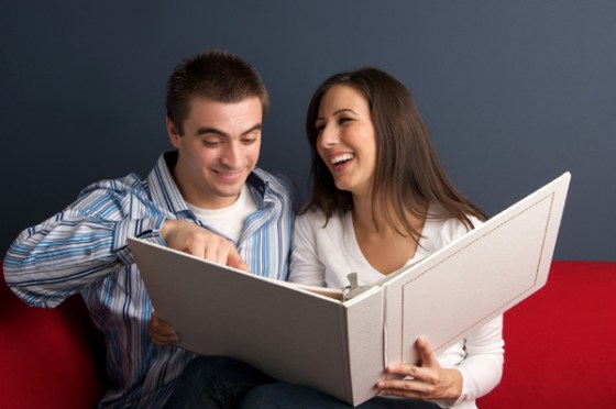 couple-looking-at-photo-album