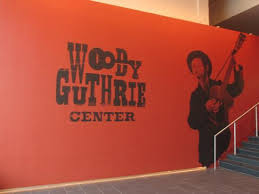 woody guthrie center orange close up sign inside