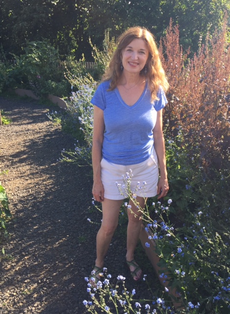 Tanna at Fairbanks Botaninal Garden August 2017 off the path by some blue flowers