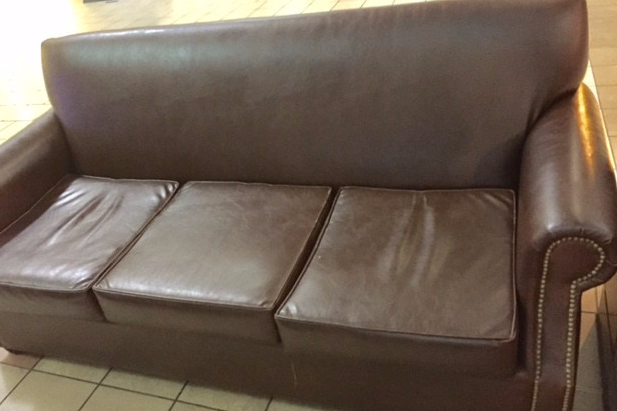The Brown Couch at the Airport