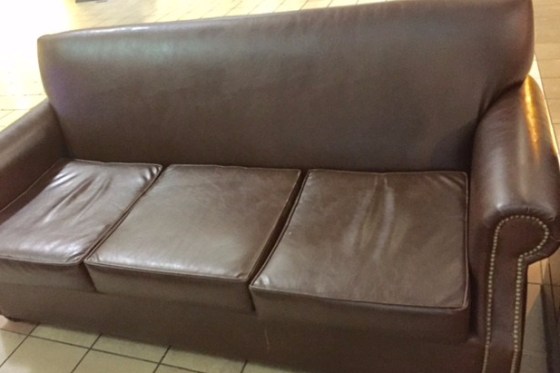 The Brown Couch at the Airport
